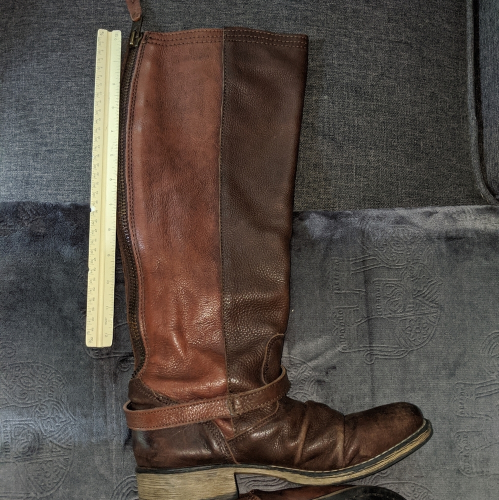 Knee high boots with buckle straps